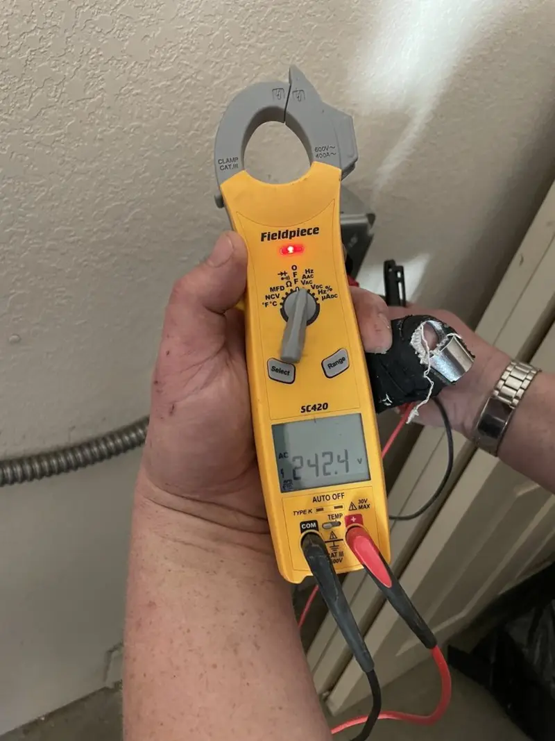 Voltage testing with clamp meter during Whole House Surge Protector in Tolono